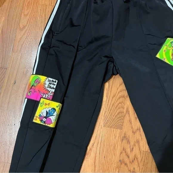 JEREMY SCOTT X ADIDAS limited track pants with cartoon patches. Nwt 90s cartoons